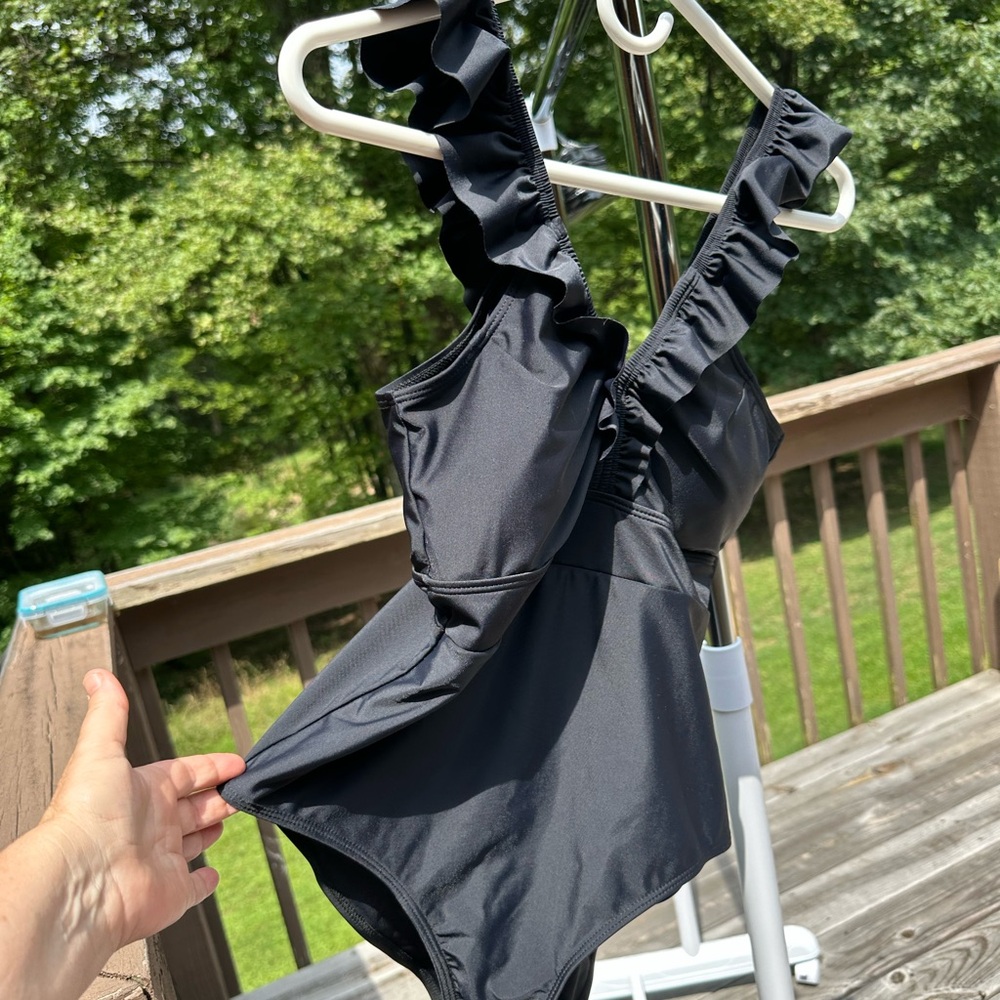 One piece swim suit with padded bust.